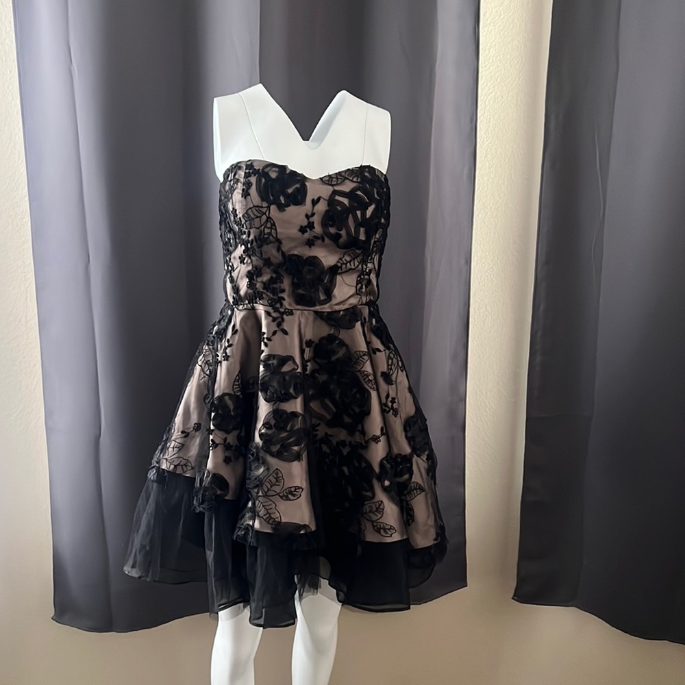 New, with tags. Strapless champagne dress with lace overlay.